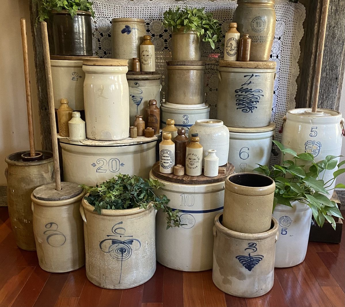 Collection of antique blue-accented stoneware crocks and jugs